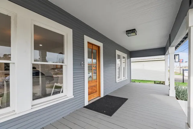 a view of an entryway of house with wooden floor