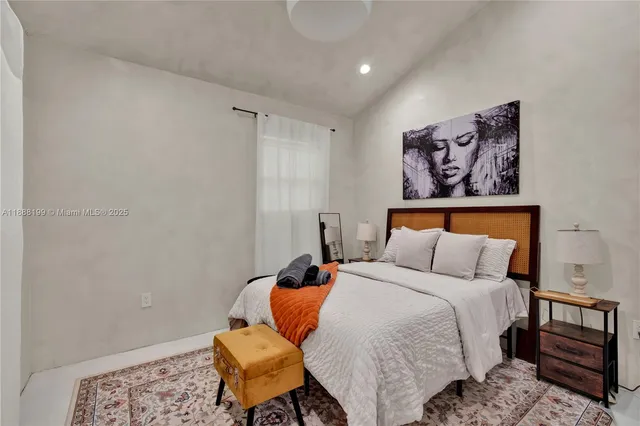 a bedroom with a bed and chair