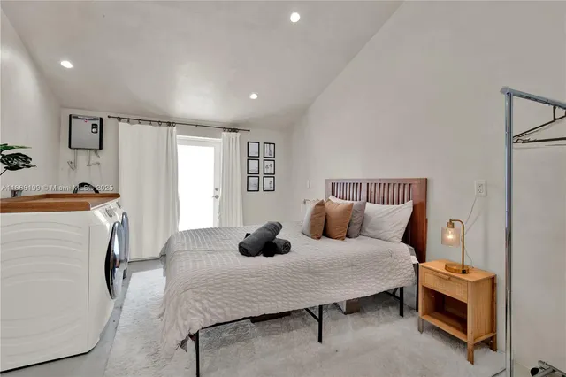 a bedroom with a bed and a couch