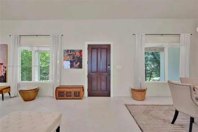 a living room with furniture and window