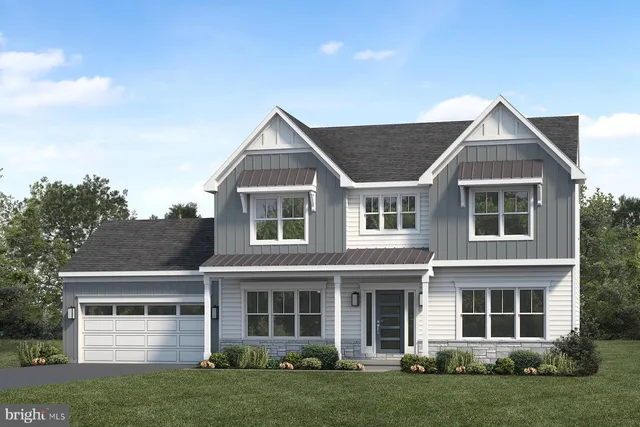 a view of a yard in front of a house with green space