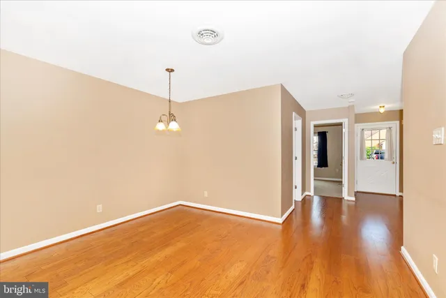 a kitchen with a stove a sink and a microwave