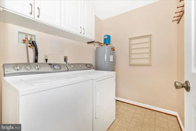 a view of a house with swimming pool and sitting area