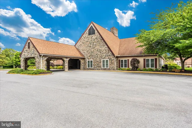 a view of house with swimming pool outdoor seating