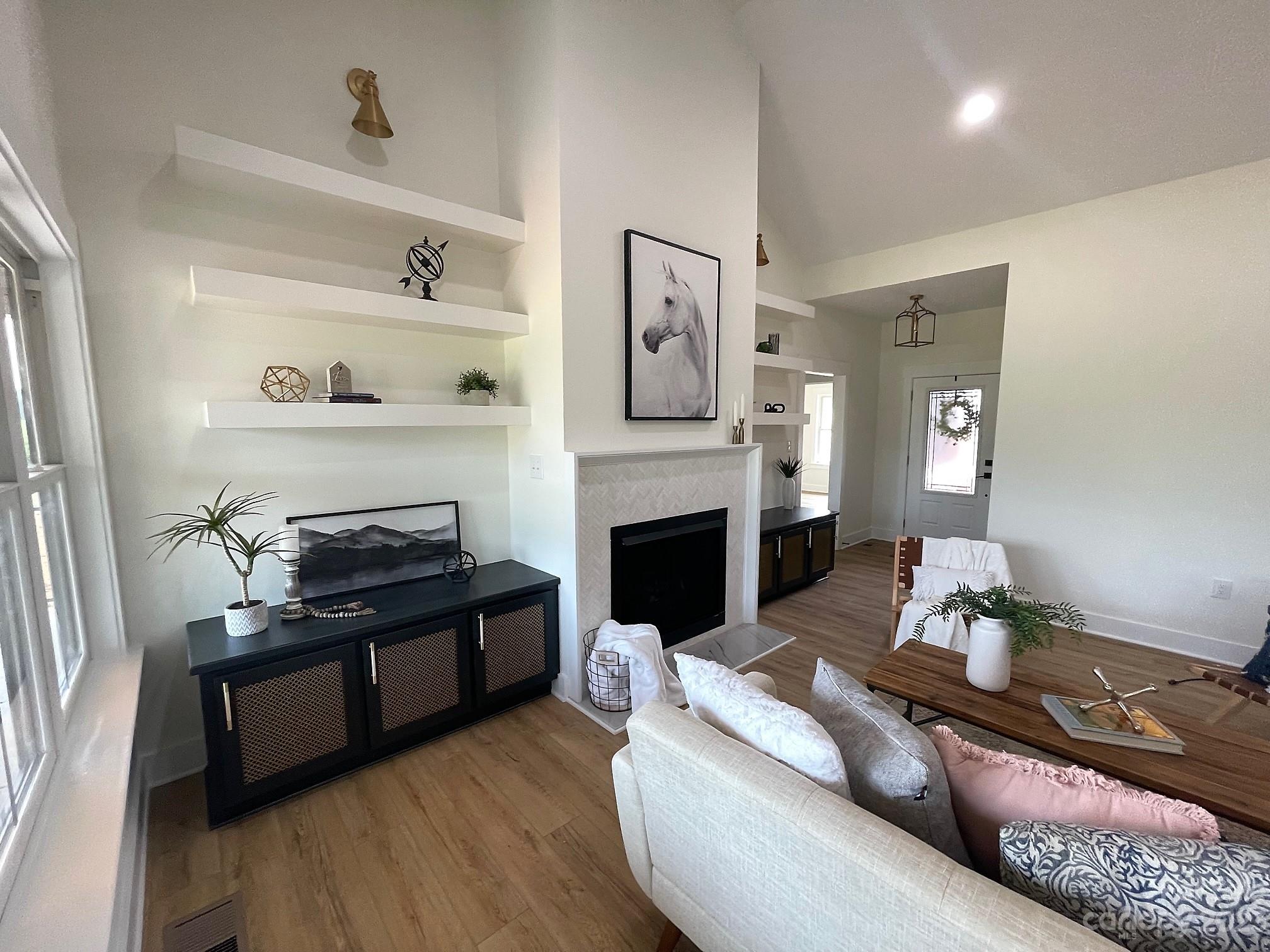 215 Cal Kennedy Road Cleveland, NC 27013 - Photo 12 of 39 a living room with furniture and a fireplace