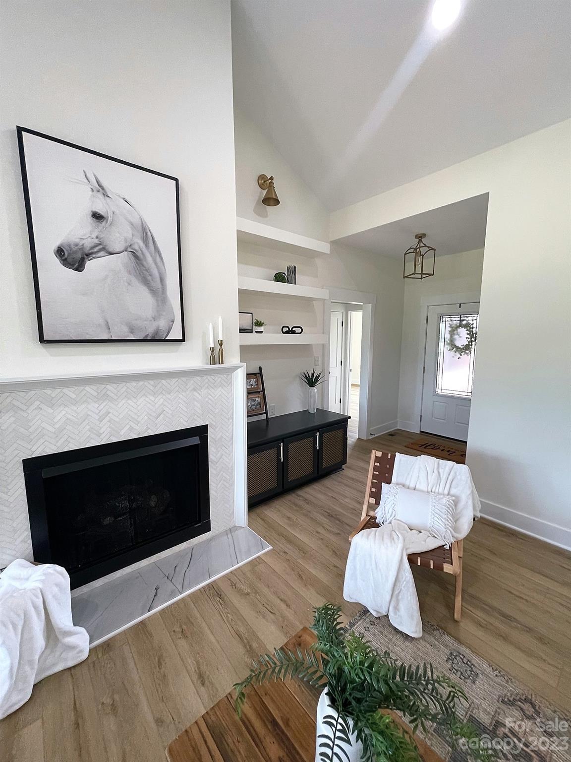 215 Cal Kennedy Road Cleveland, NC 27013 - Photo 14 of 39 a living room with furniture and a fireplace