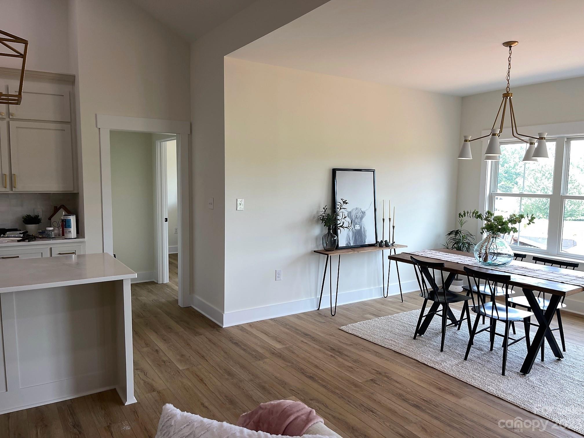 215 Cal Kennedy Road Cleveland, NC 27013 - Photo 15 of 39 a view of a dining room with furniture and wooden floor