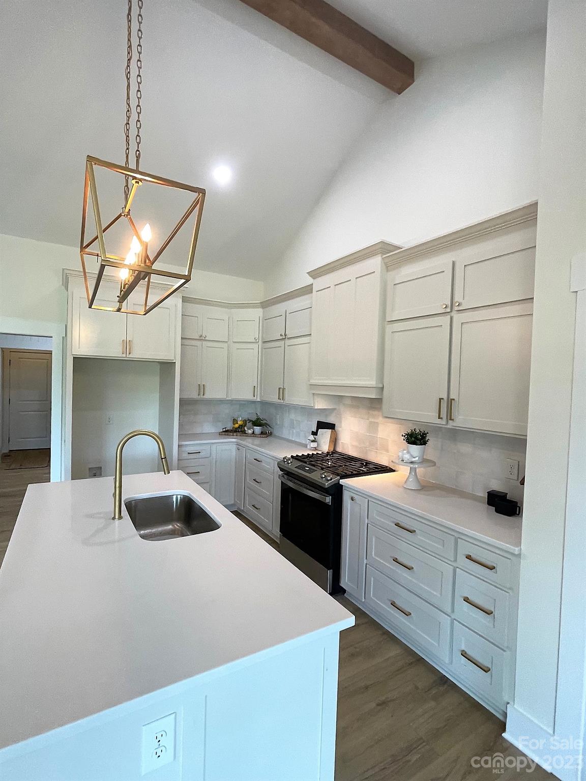 215 Cal Kennedy Road Cleveland, NC 27013 - Photo 19 of 39 a kitchen with a sink and a stove top oven