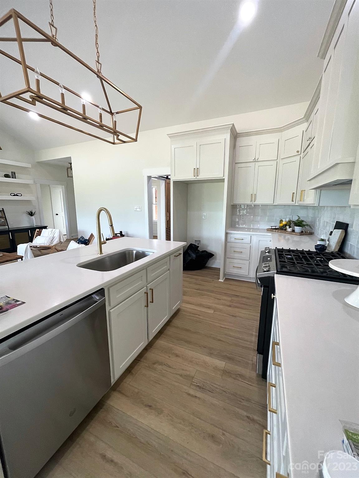 215 Cal Kennedy Road Cleveland, NC 27013 - Photo 21 of 39 a kitchen with cabinets a sink and appliances