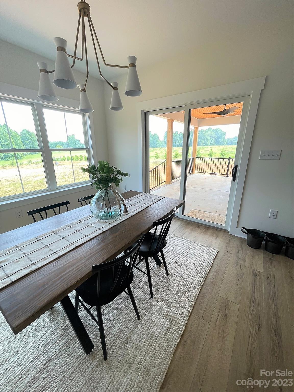 215 Cal Kennedy Road Cleveland, NC 27013 - Photo 22 of 39 a view of a dining room with furniture window and wooden floor