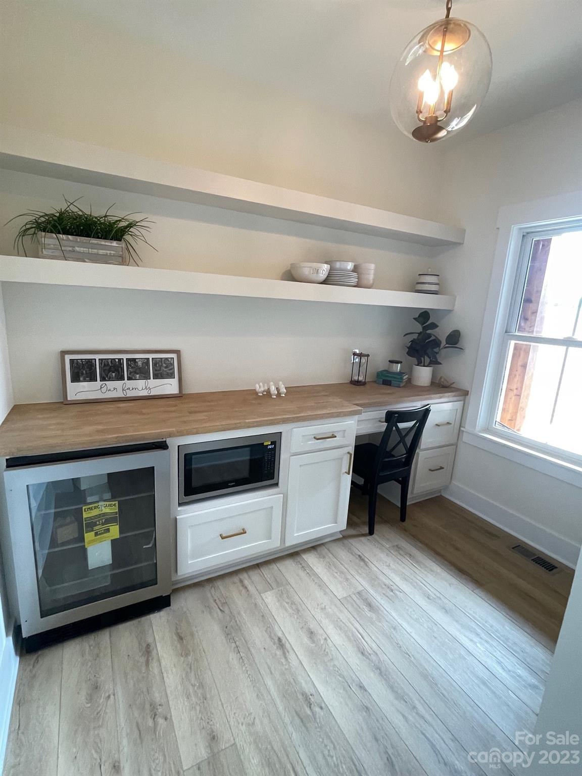 215 Cal Kennedy Road Cleveland, NC 27013 - Photo 25 of 39 a kitchen with stainless steel appliances granite countertop a stove a sink and a microwave