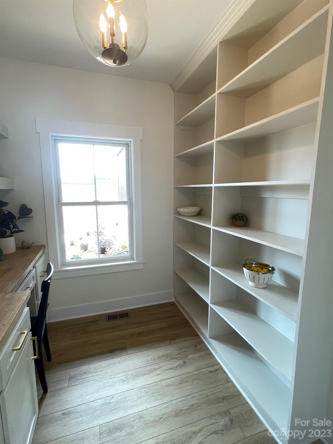 215 Cal Kennedy Road Cleveland, NC 27013 - Photo 26 of 39 a view of room with window and wooden floor
