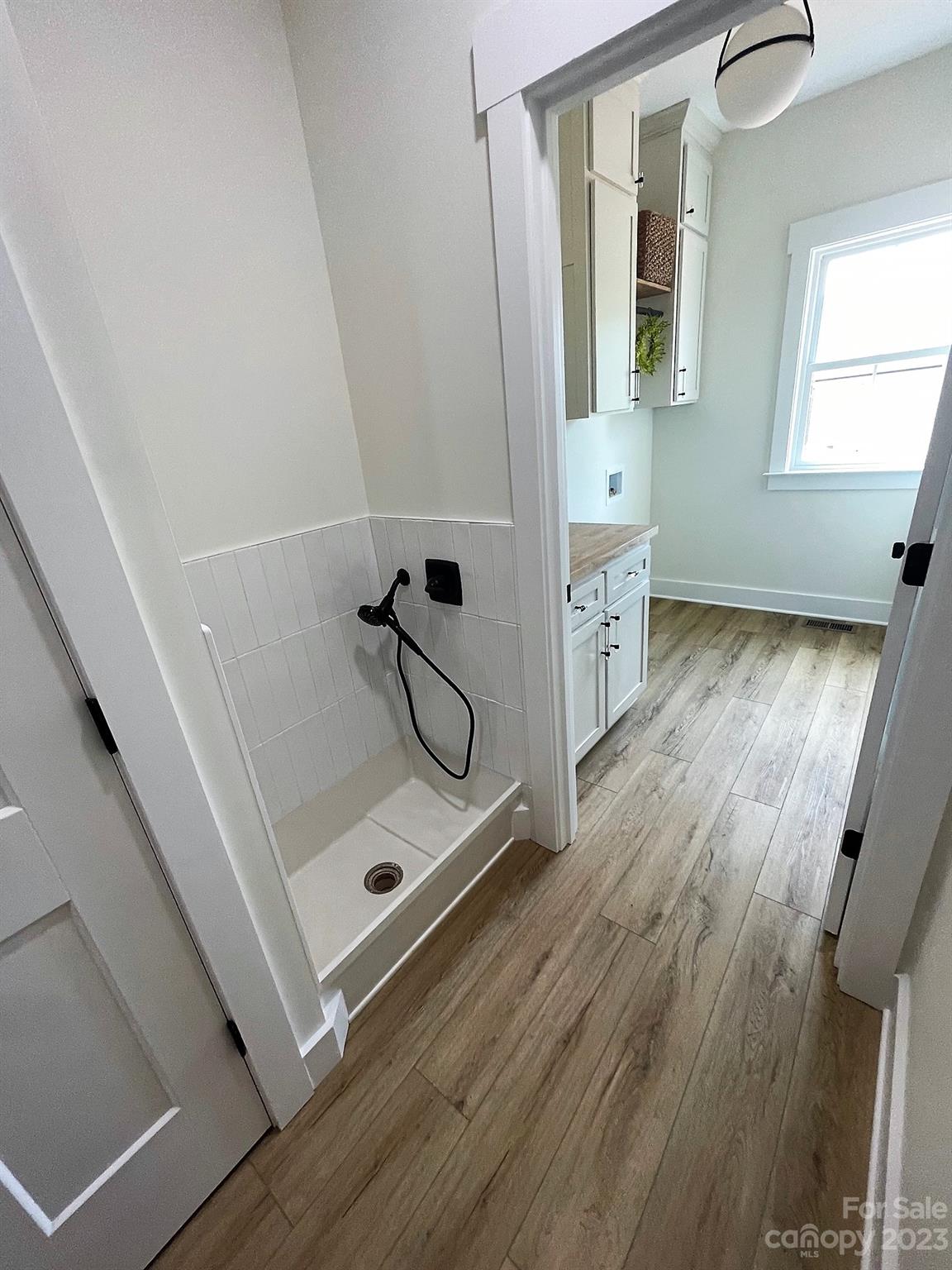 215 Cal Kennedy Road Cleveland, NC 27013 - Photo 28 of 39 a bathroom with a double vanity sink and mirror