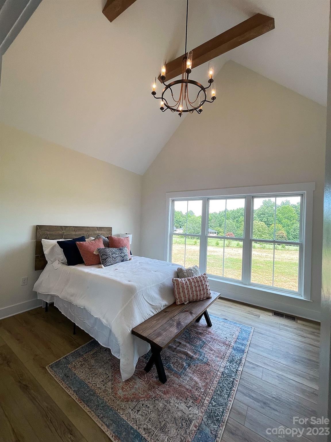 215 Cal Kennedy Road Cleveland, NC 27013 - Photo 29 of 39 a bed sitting in a bedroom next to a window