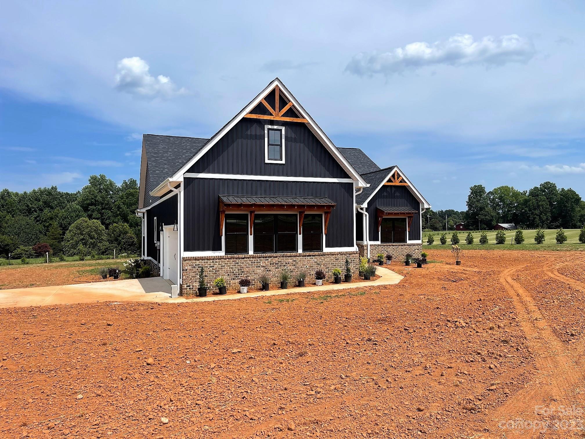 215 Cal Kennedy Road Cleveland, NC 27013 - Photo 3 of 39 a front view of a house with a yard