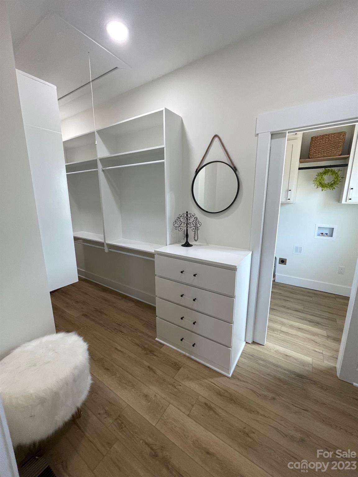 215 Cal Kennedy Road Cleveland, NC 27013 - Photo 33 of 39 a room with a cabinets and a mirror