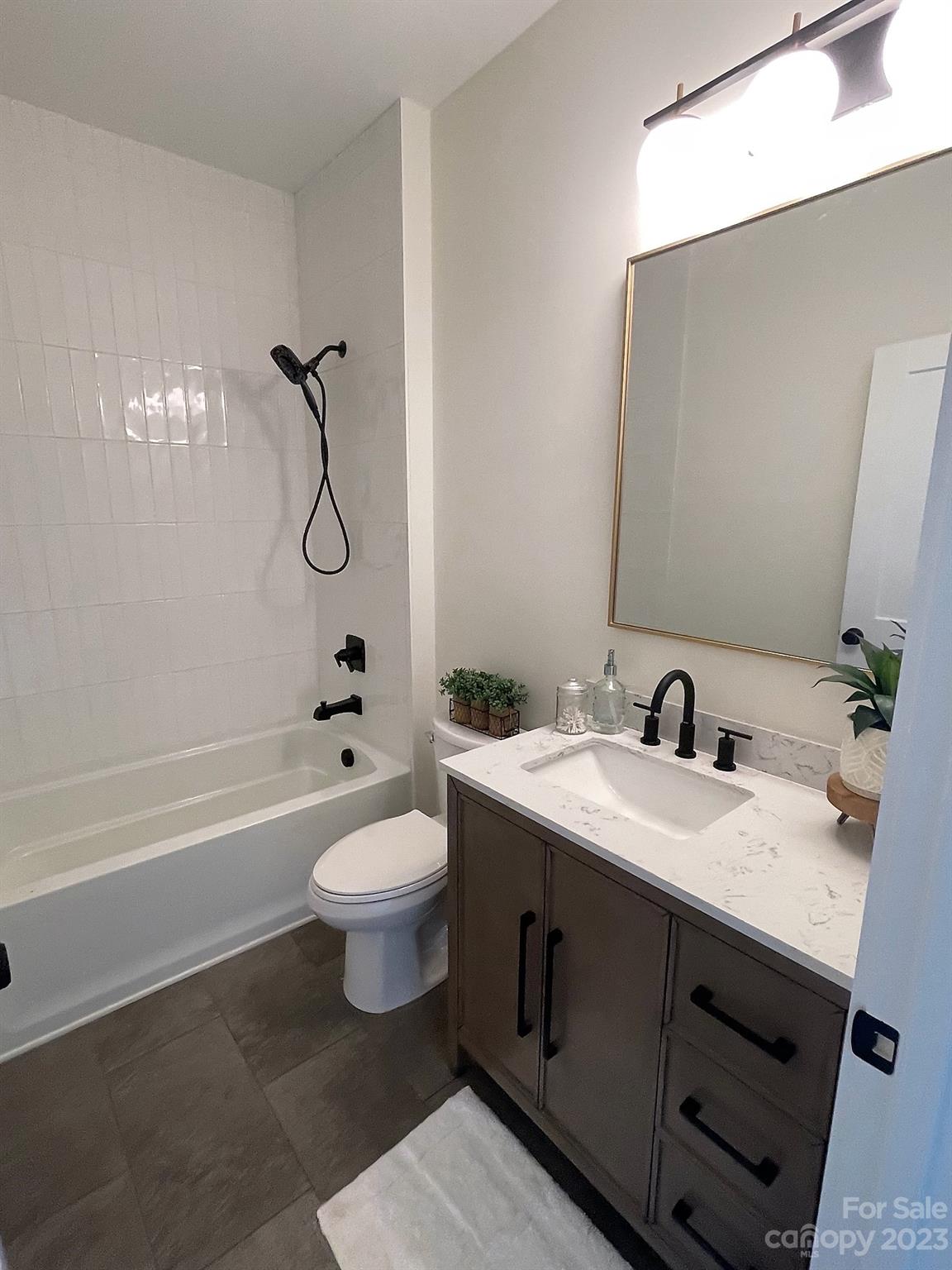 215 Cal Kennedy Road Cleveland, NC 27013 - Photo 36 of 39 a bathroom with a sink a toilet and shower