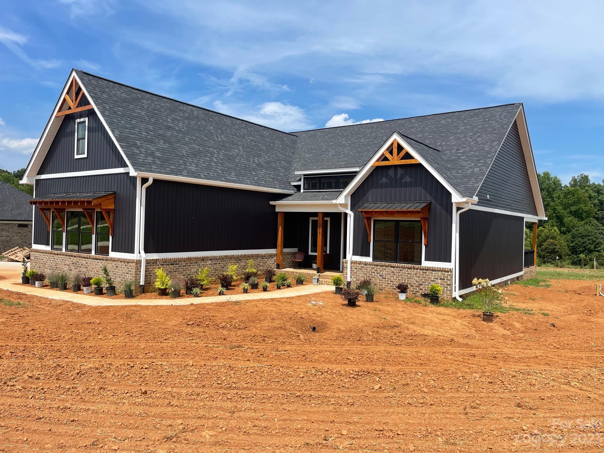 215 Cal Kennedy Road Cleveland, NC 27013 - Photo 4 of 39 a front view of a house with a yard
