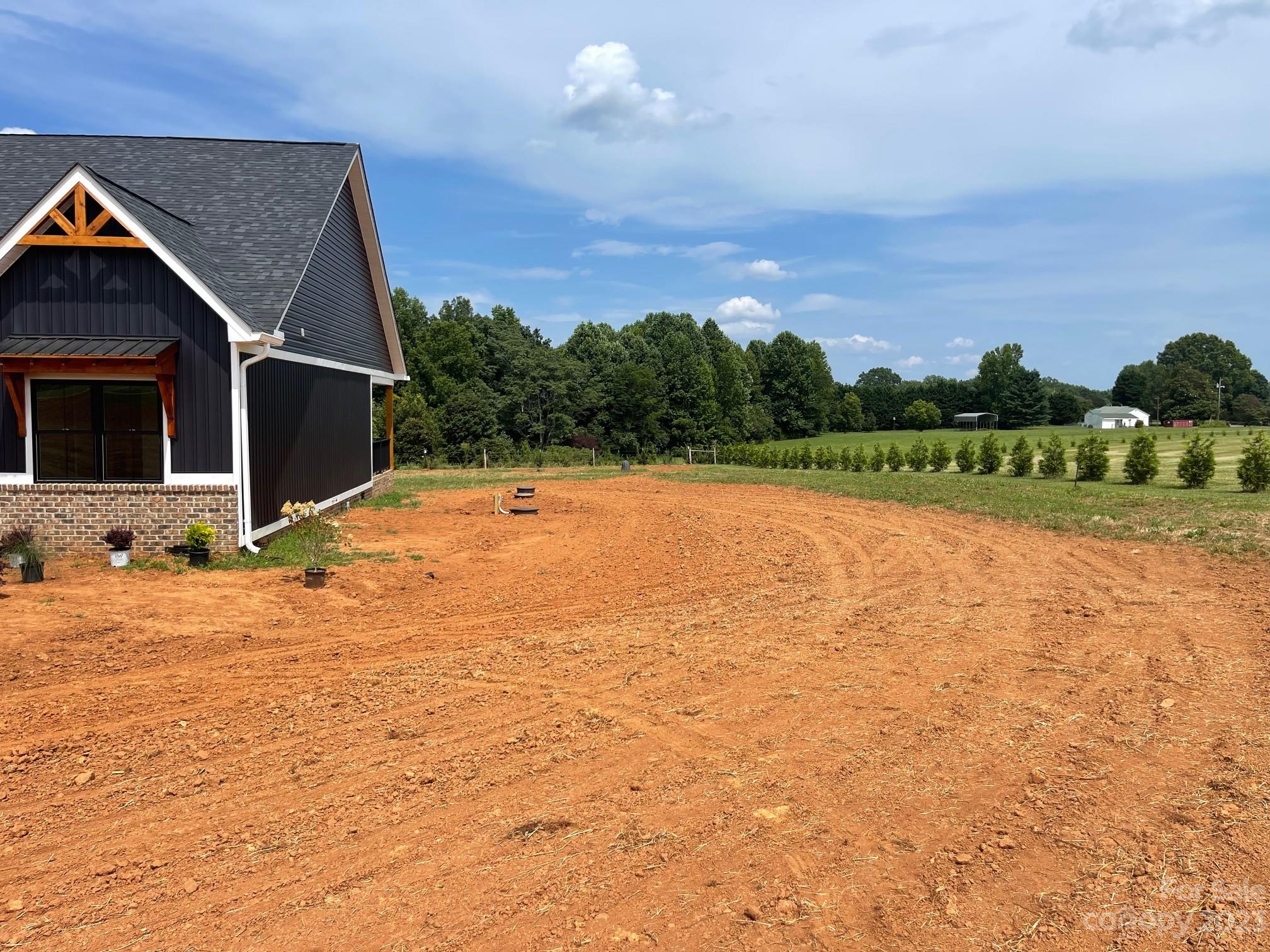 215 Cal Kennedy Road Cleveland, NC 27013 - Photo 5 of 39 a view of swimming pool with an outdoor space and seating area