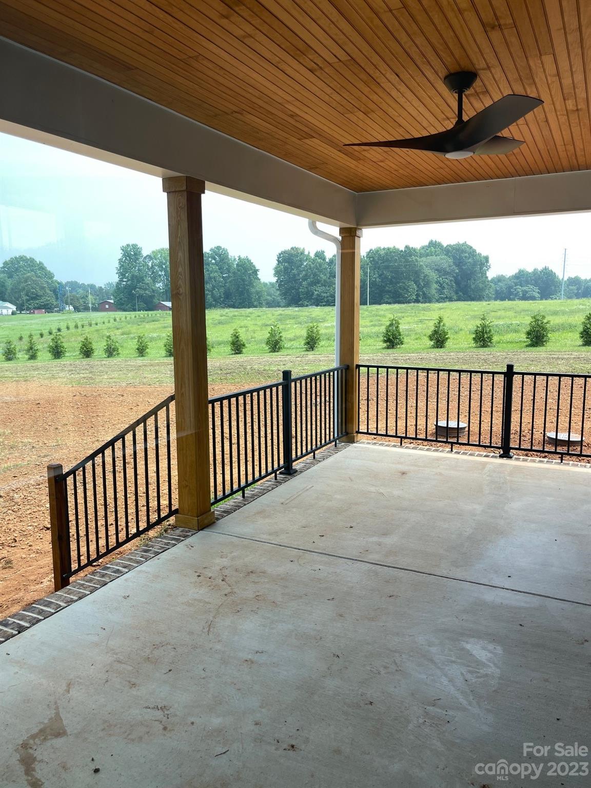 215 Cal Kennedy Road Cleveland, NC 27013 - Photo 8 of 39 a view of a porch with a yard