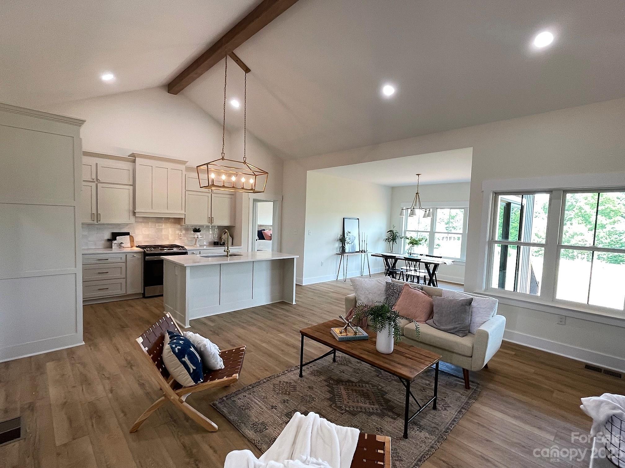 215 Cal Kennedy Road Cleveland, NC 27013 - Photo 9 of 39 a living room with furniture fireplace and wooden floor