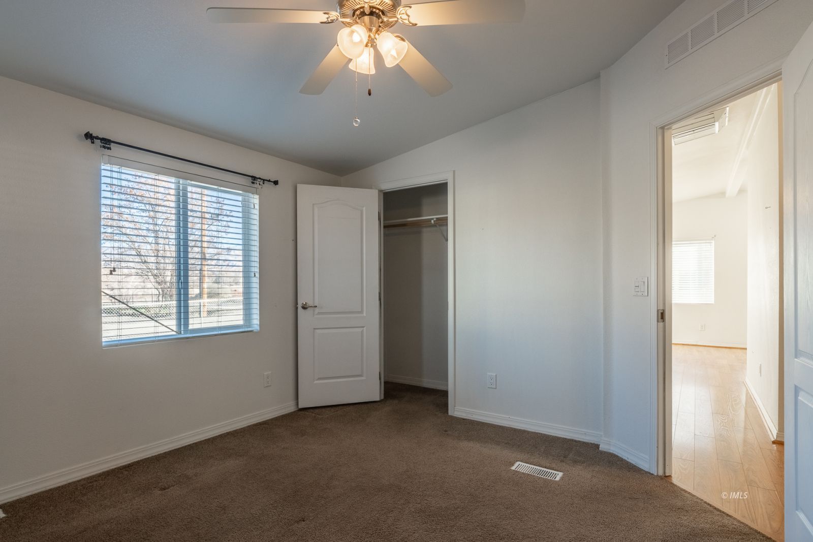 231 West Street Big Pine, CA 93513 - Photo 14 of 23 a view of a livingroom with a chandelier fan and windows