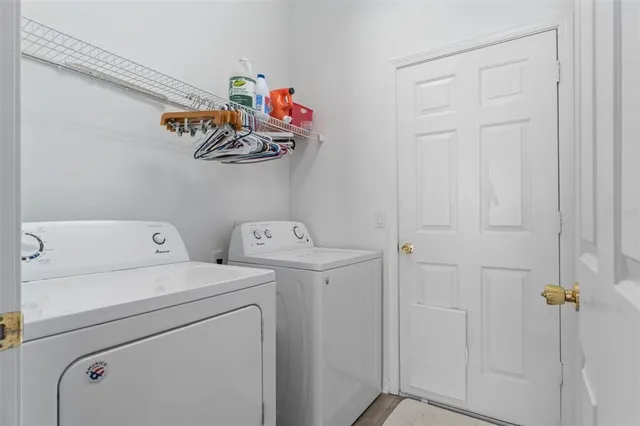 a view of a hallway with windows and stairs