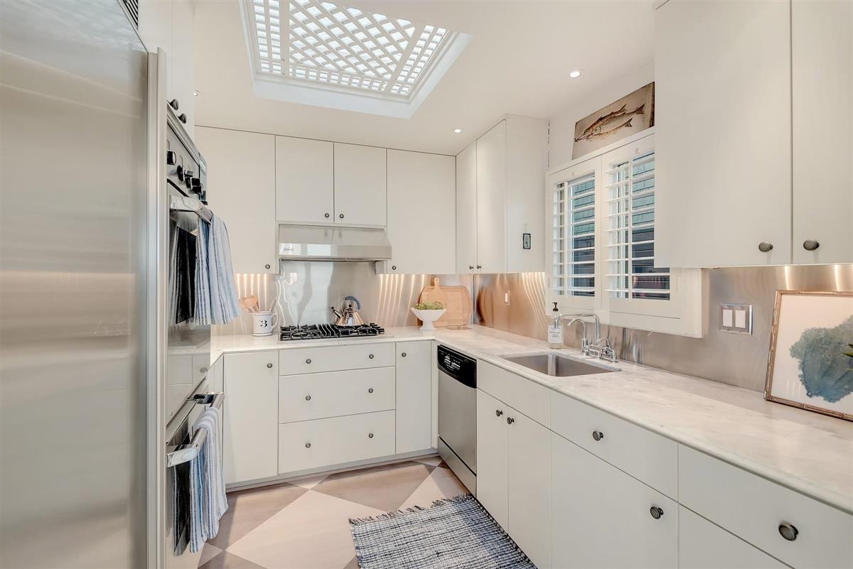 759 Las Olas Drive Aptos, CA 95003 - Photo 13 of 50 a kitchen with granite countertop a sink cabinets stainless steel appliances and a window