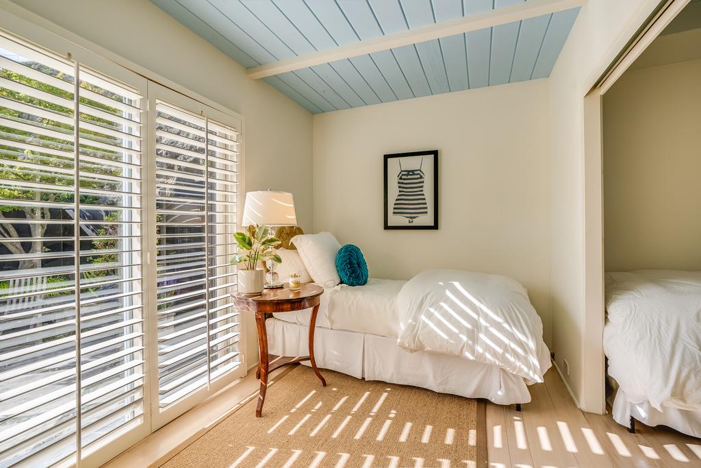 759 Las Olas Drive Aptos, CA 95003 - Photo 36 of 50 a bedroom with a bed and a painting on the wall