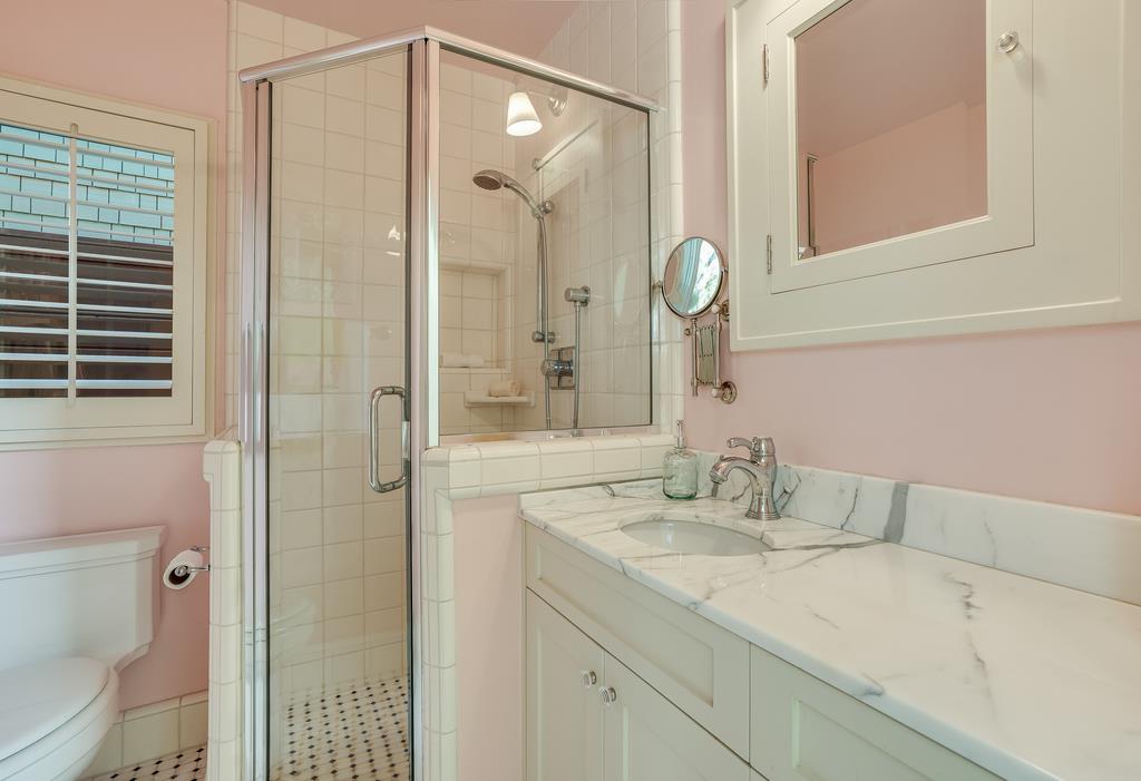 759 Las Olas Drive Aptos, CA 95003 - Photo 38 of 50 a bathroom with a granite countertop sink a toilet and shower