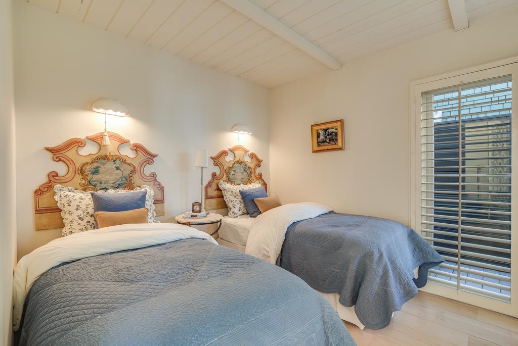759 Las Olas Drive Aptos, CA 95003 - Photo 39 of 50 a bedroom with two beds and a chandelier