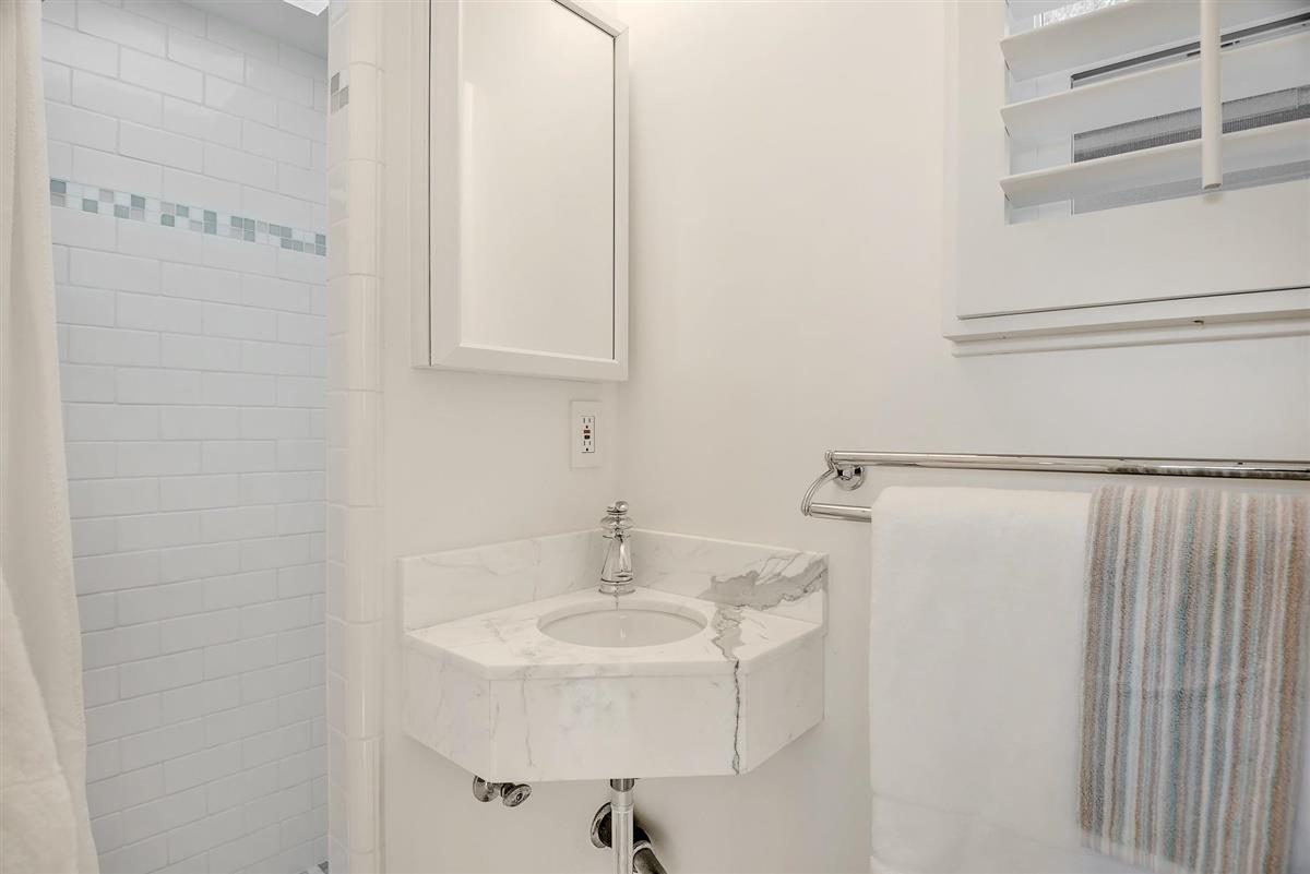 759 Las Olas Drive Aptos, CA 95003 - Photo 43 of 50 a bathroom with a sink and a mirror