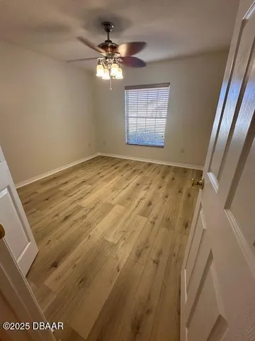 a view of an empty room with a window