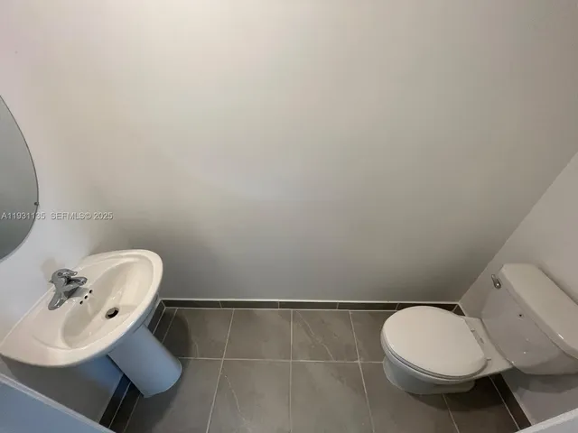 a bathroom with a toilet and a sink