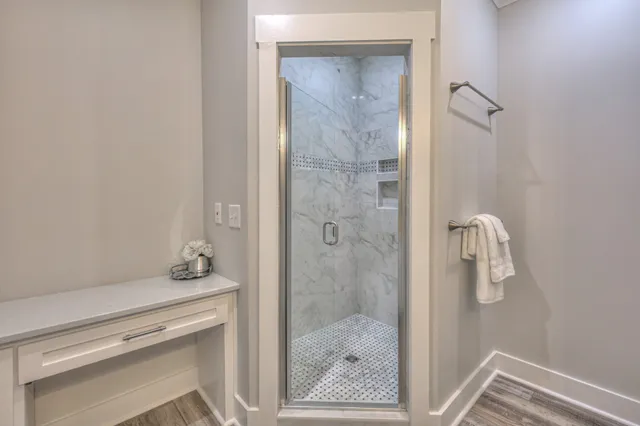 a view of an empty room and wooden floor