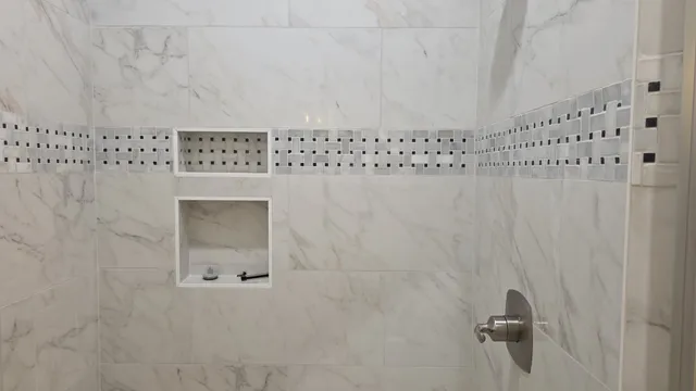 a spacious bathroom with double vanity a toilet a shower and a mirror