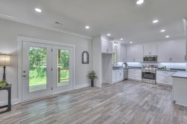 a kitchen with a refrigerator and a sink