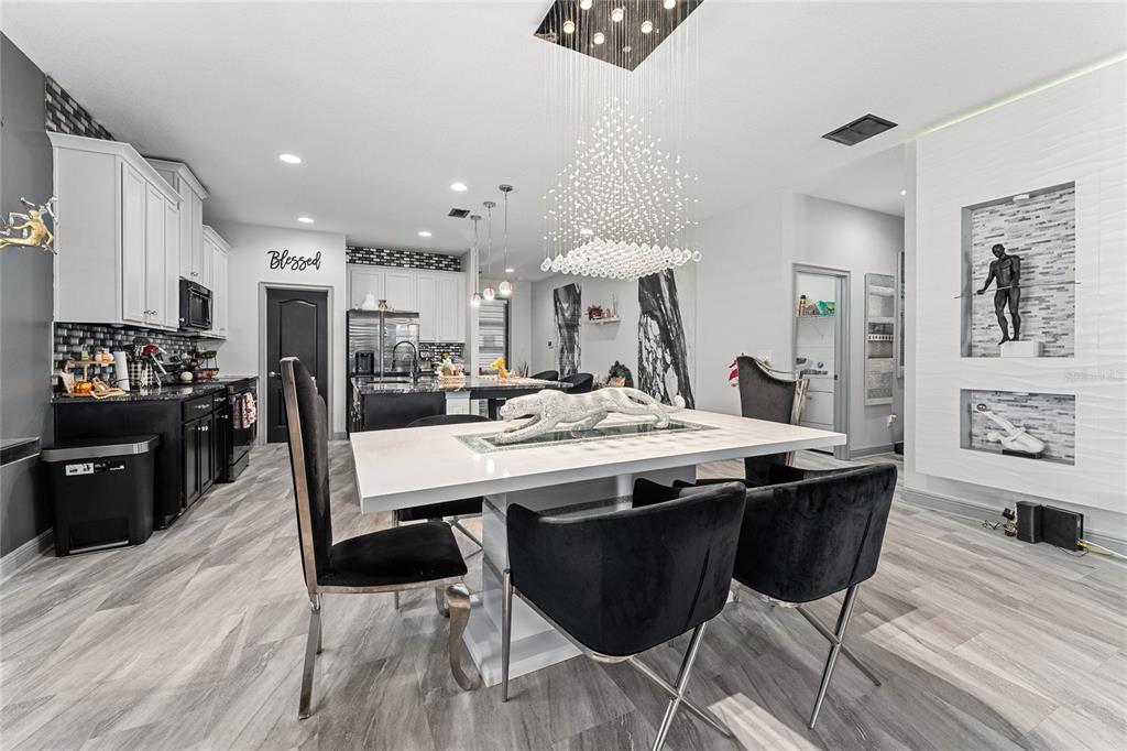 3199 Crispin Circle Harmony, FL 34773 - Photo 11 of 37 a view of a kitchen and dining area with chandelier