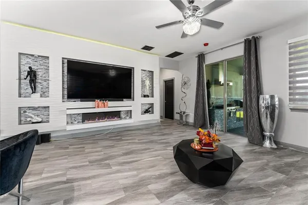 a living room with furniture and a flat screen tv