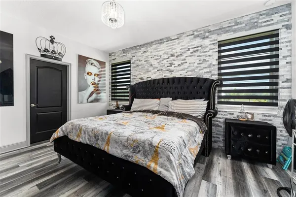 a bedroom with a bed and a fireplace