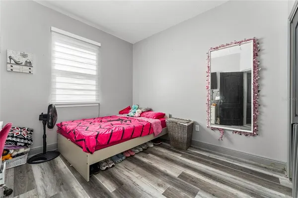 a room with a bed and a window