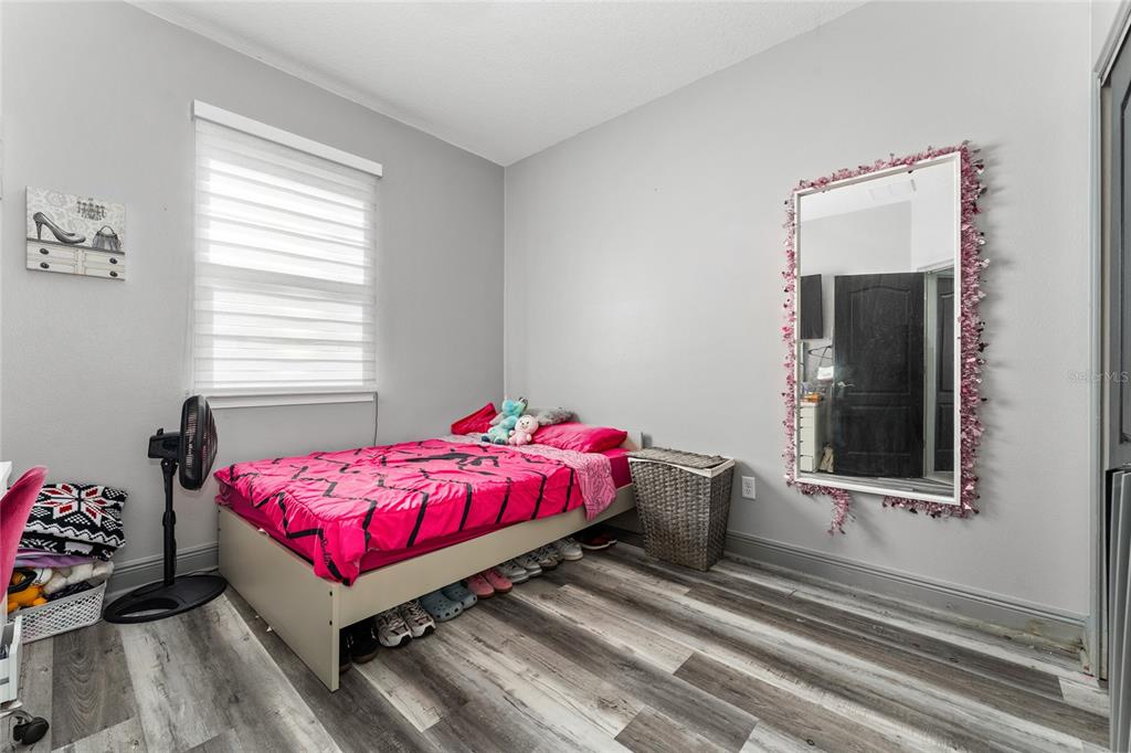 3199 Crispin Circle Harmony, FL 34773 - Photo 18 of 37 a room with a bed and a window