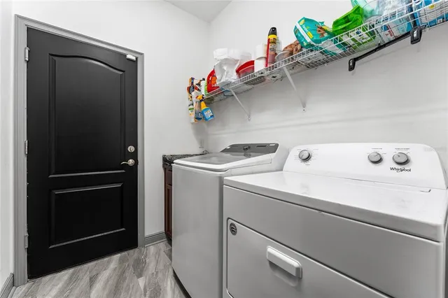 a view of a house with a backyard porch and sitting area