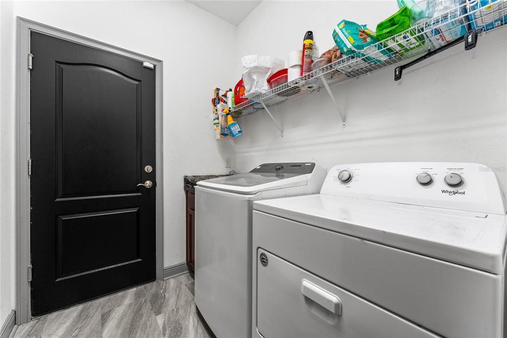 3199 Crispin Circle Harmony, FL 34773 - Photo 20 of 37 a utility room with dryer and washer