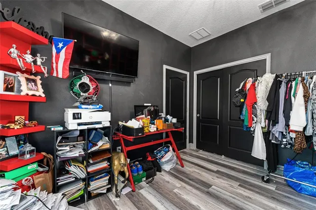 an aerial view of a house with outdoor seating swimming pool and ocean view