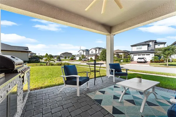 a view of a patio with swimming pool