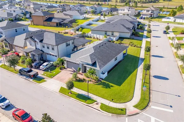 an aerial view of a house with a swimming pool yard and outdoor seating