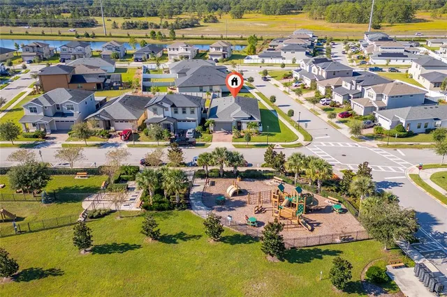 an aerial view of a house with a swimming pool