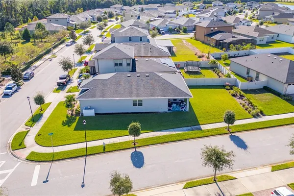 an aerial view of a house with a swimming pool