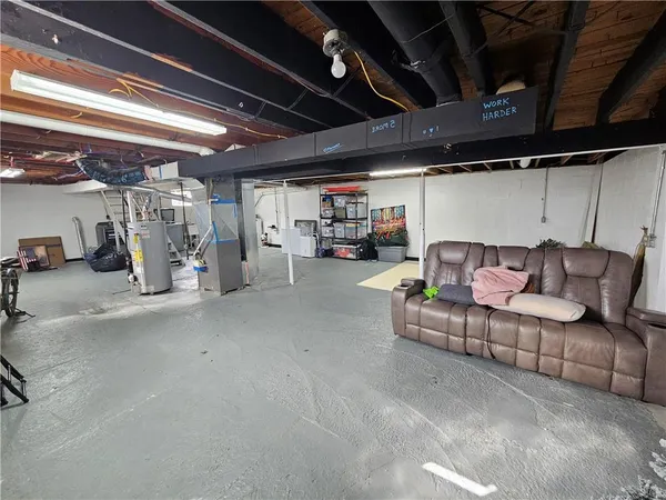 a view of garage with cars
